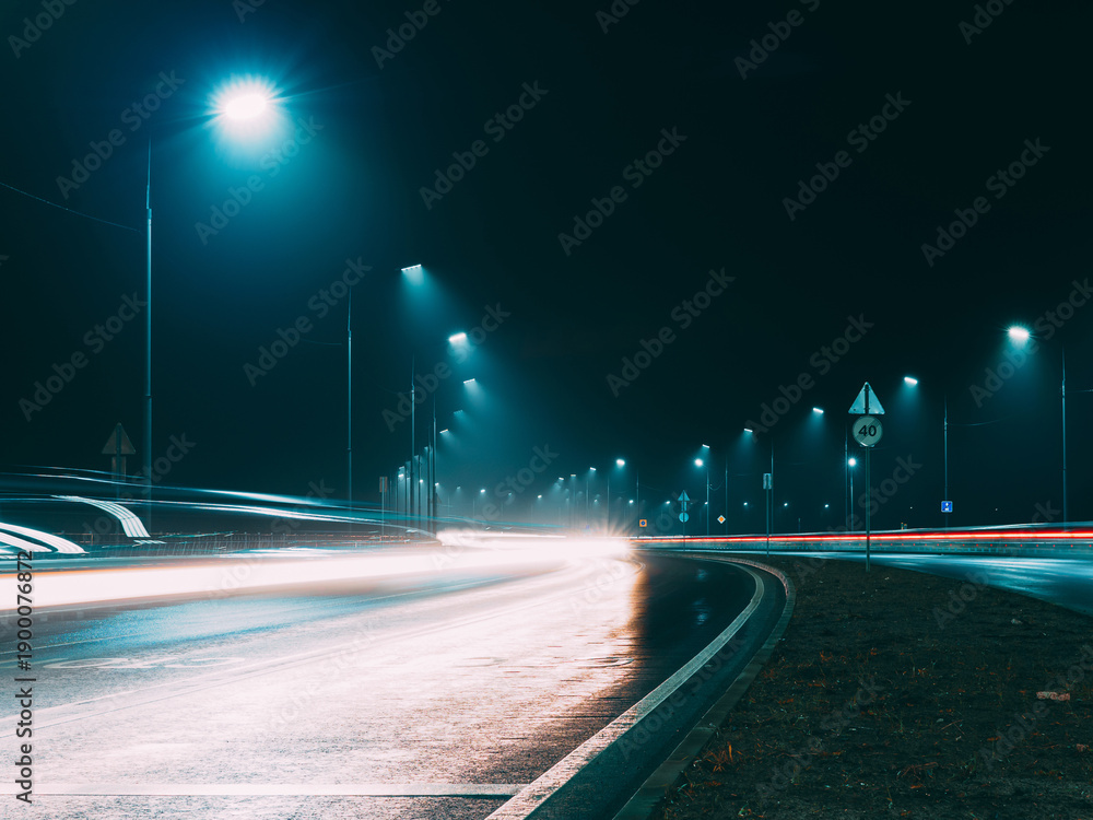 Naklejka premium Foggy night highway , car tracks