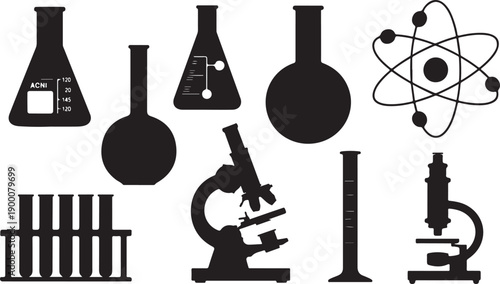 Black silhouettes of scientific laboratory equipment and atom model