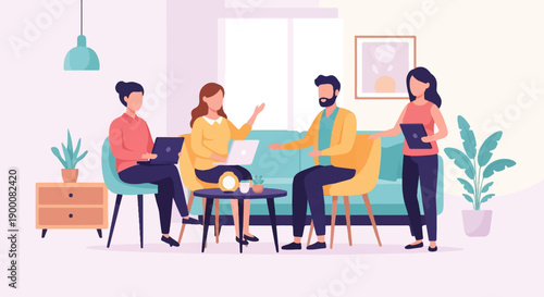 Four people collaborating in a modern office lounge area with laptops and tablets