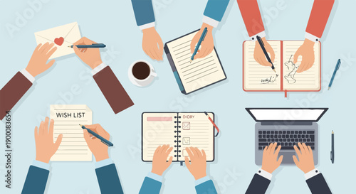 People gathered around a table writing and using a laptop