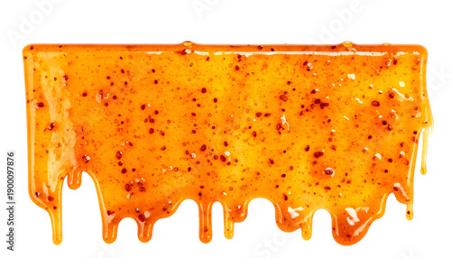 A rectangular block of golden-orange food, glistening with drips against a black background