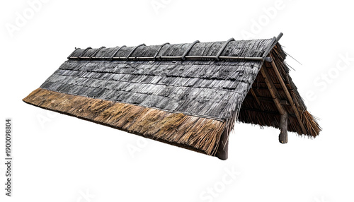 A weathered thatched roof shelter with angled supports and a textured, layered design