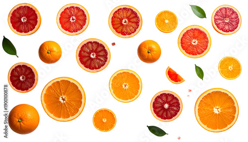 Sliced citrus fruit arrangement, some whole, some with leaves, on black background