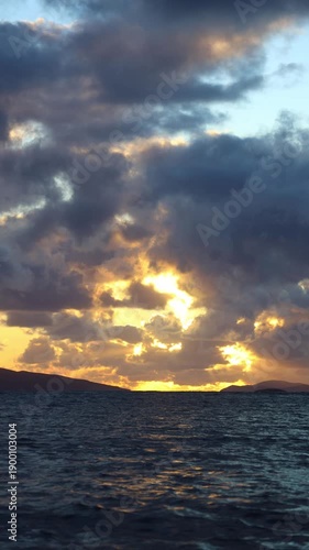 Magnificent sunset on a cloudy day over the Aegean Sea in autumn. vertical video for social media.	
