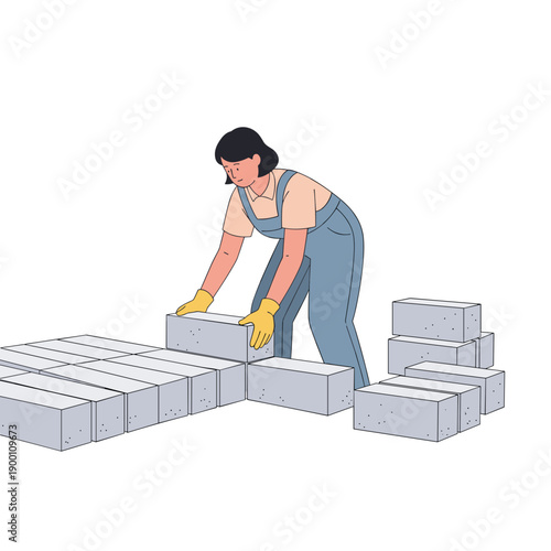 Woman laying concrete blocks while working on construction site  