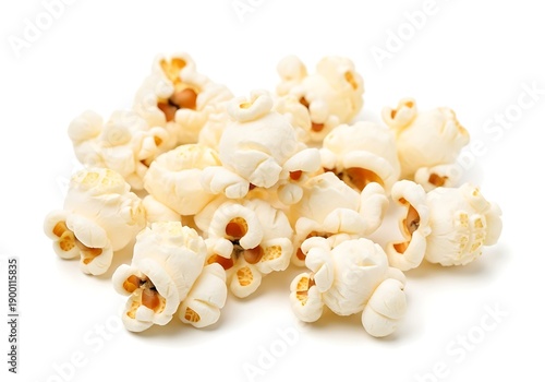 A pile of freshly popped popcorn with salt on a white background.