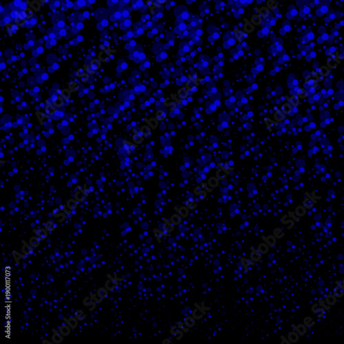 Blue sparkles falling from above on a black background. Conceptual design for a greeting card, banner for New Year's, Christmas, birthday, or party celebrations. Background with circles with a bokeh 