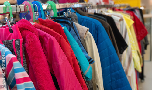 Colorful clothes swap rack with hanging garments
