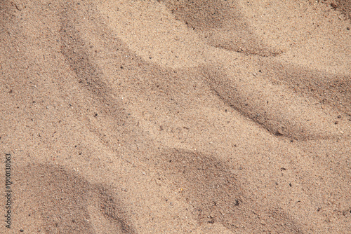 Sand texture at the beach close-up background with copy space