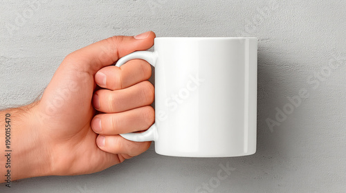 Male hand holding a ceramic...