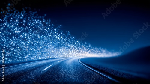 Road with a blue sky in the background. The sky is filled with stars and the road is illuminated by the stars
