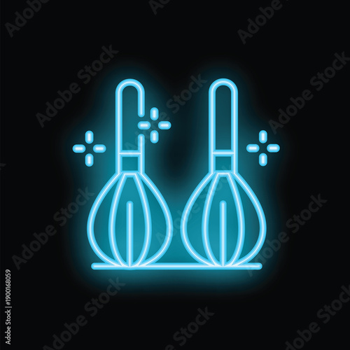 Neon sign of two kitchen whisks shining on black background