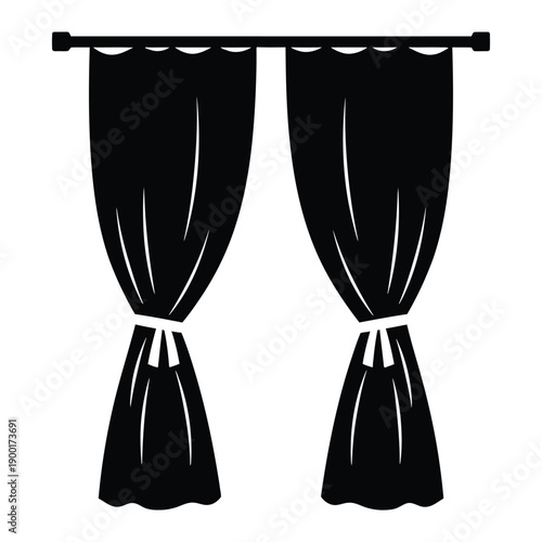 Black curtains tied back on a rod in a simple design