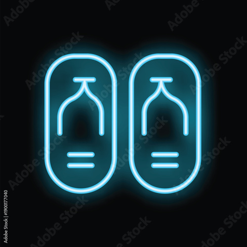 Neon sign showing a pair of flip flops glowing on a black background