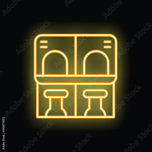 Yellow glowing neon icon of two train seats facing each other, with a table in between them