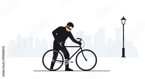 A silhouetted figure on a bicycle rides beneath a street lamp