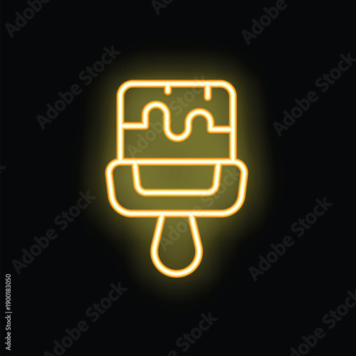 Yellow neon sign in the shape of a paint brush, shining brightly against a dark background