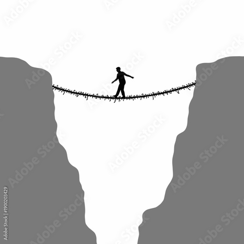 Silhouette of Person Balancing on Thin Rope Bridge Suspended Between Two Cliffs in High Contrast Black and White