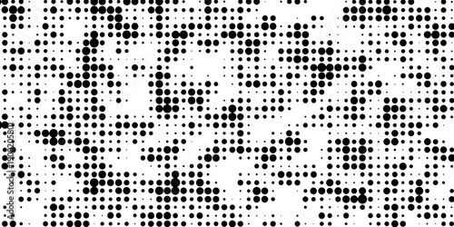 Abstract pop art halftone and seamless vintage distressed small dot background pattern, black and white abstract image displaying a dense randomized pattern of small circular dots across the design.