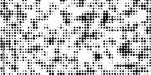 Abstract pop art halftone and seamless vintage distressed small dot background pattern, black and white abstract image displaying a dense randomized pattern of small circular dots across the design.
