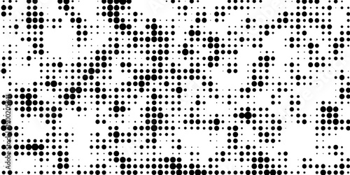 Abstract pop art halftone and seamless vintage distressed small dot background pattern, black and white abstract image displaying a dense randomized pattern of small circular dots across the design.