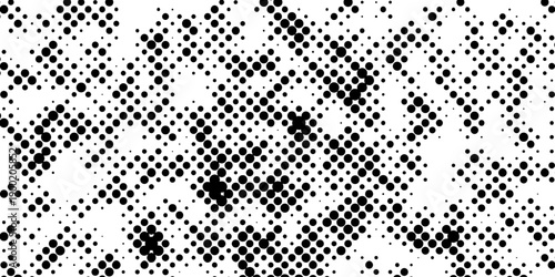 Abstract pop art halftone and seamless vintage distressed small dot background pattern, black and white abstract image displaying a dense randomized pattern of small circular dots across the design.