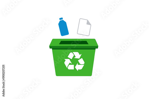 Green recycling bin with a blue plastic bottle and paper being thrown in from above during a clear day in a public area
