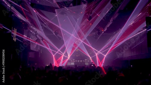 Nightclub Crowd Filming with Mobile Phones Under Laser Lights