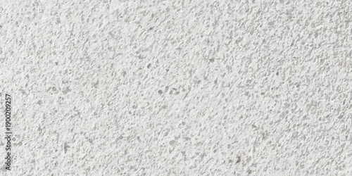 High resolution abstract gray asphalt and concrete surface texture with rough granular details, grit, stone like noise, scattered speckles and soft tonal variation for wallpaper and overlays. 