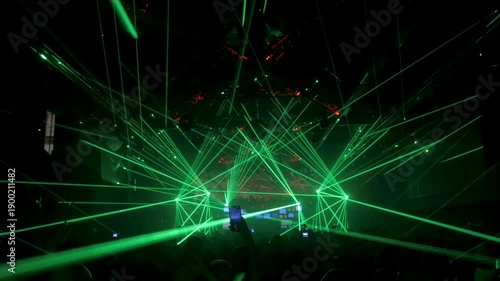 Nightclub Crowd Filming with Mobile Phones Under Laser Lights
