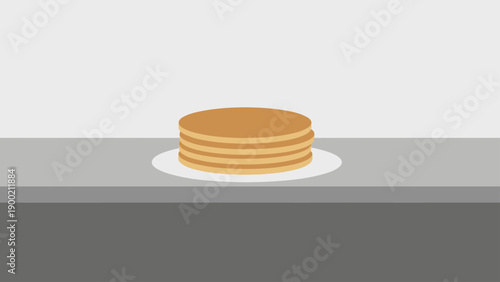A stack of golden pancakes on a white plate sits centered on a gray surface