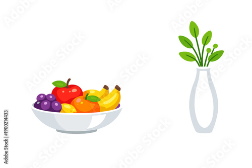 Colorful fruit bowl and vase with green leaves on a white background during a bright and sunny afternoon
