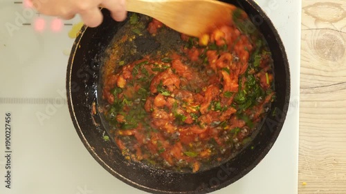 Process of cooking tomato sauce on the pan
