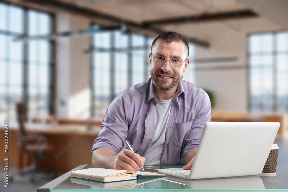 Fototapeta premium Talking, happy customer service worker in call center