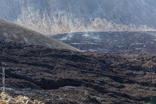 Tableau sur toile Fagradalsfjall volcano lava field with cooling basaltic rock flow and steaming v