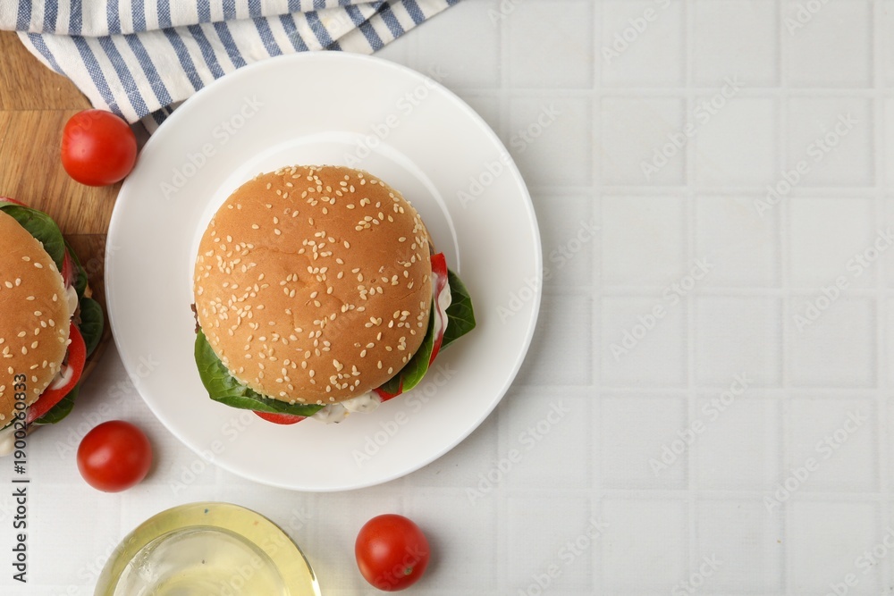 Naklejka premium Delicious burgers with meat patties on white table, flat lay. Space for text
