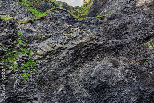 Halsanefshellir Cave curved basalt columns on Reynisfjara Black Sand Beach, Iceland
