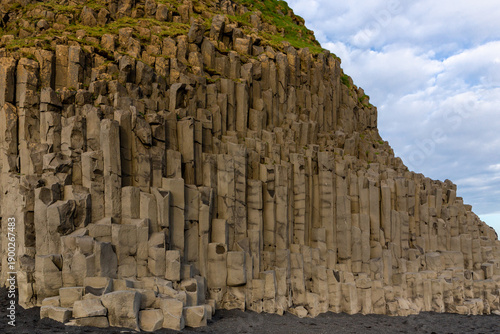 Tiered hexagonal basalt columns at Mount Reynisfjall on Reynisfjara Black Sand Beach, Iceland