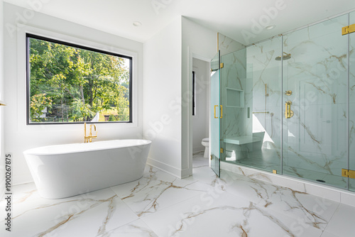 Modern bathroom interior with freestanding bathtub and glass walk-in shower