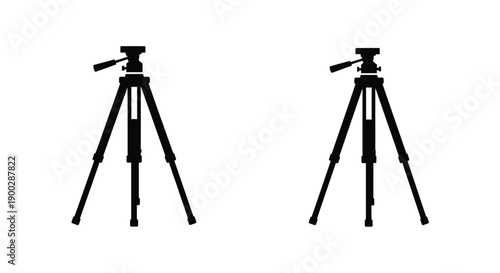 Two black tripods stand side by side a stark visual silhouette