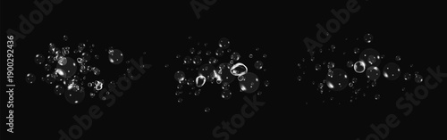 Realistic oxygen bubbles in water on a black background with fizzy sparkles and effervescent style. 