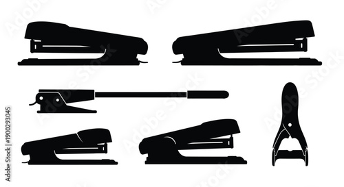 Four black office staplers in a stark graphic silhouette