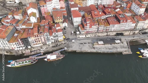 Top Down Aerial Flyover of Ribeira Waterfront and Douro River in Porto