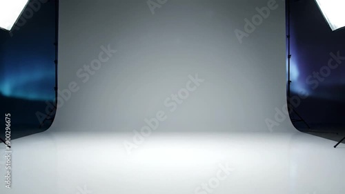 Professional photography studio setup with softbox lights and gray background