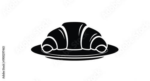 A black silhouette of a croissant resting on a plate silhouette