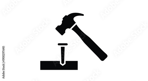 Hammer poised above nail on wood a stark black silhouette