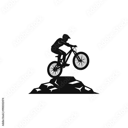 Biker Silhouette Over the Mountain: A silhouette of a cyclist gracefully navigates a rugged mountain landscape, encapsulating the spirit of adventure and thrill in an active outdoor pursuit.
