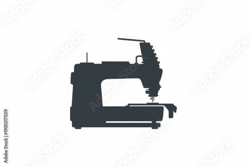 Silhouette of a Sewing Machine: A stark and simple depiction of a sewing machine, ready for a day of creative work.