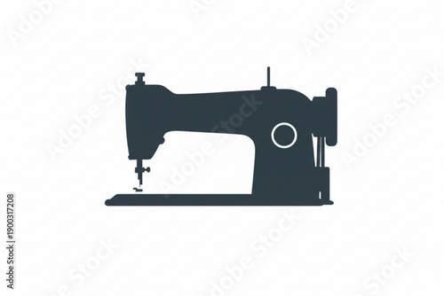 Silhouette of a Sewing Machine: A classic sewing machine in silhouette against a clear backdrop, its intricate details and timeless design capture the essence of craft and creation.