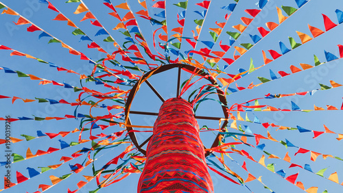 Photography Colorful flags and ribbons decorating a maypole in Moscow for a summer celebrati